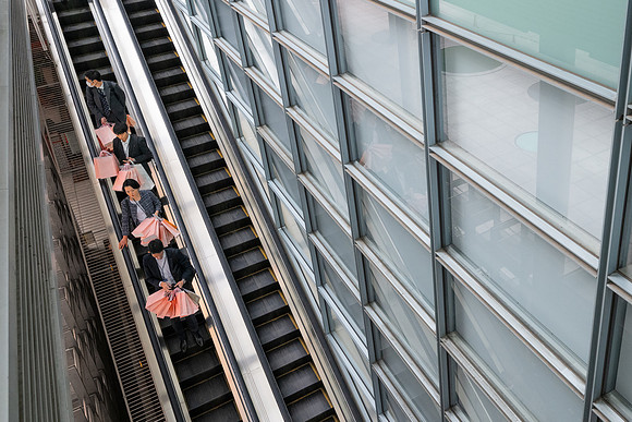 Tokyo pink bags on escalator