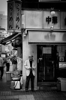 Tokyo Man on corner BW