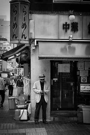 Tokyo Man on corner BW