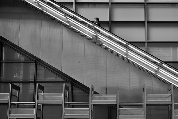 Tokyo Man on escalator BW