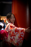 Tokyo Kimono girl hugging red pillar