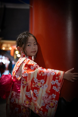 Tokyo Kimono girl hugging red pillar