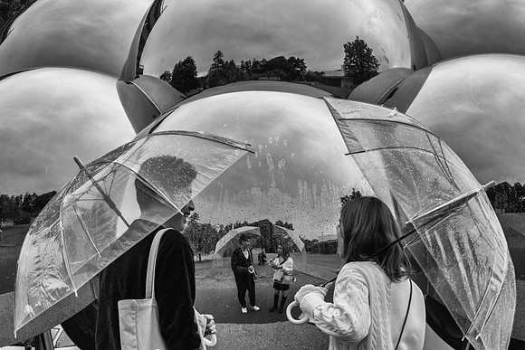 Kanazawa reflection balls rain umbrellas BW