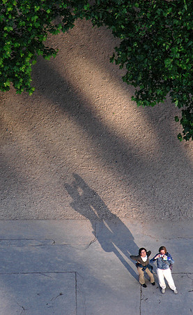 paris may 04 couple shadows from eiffel tower