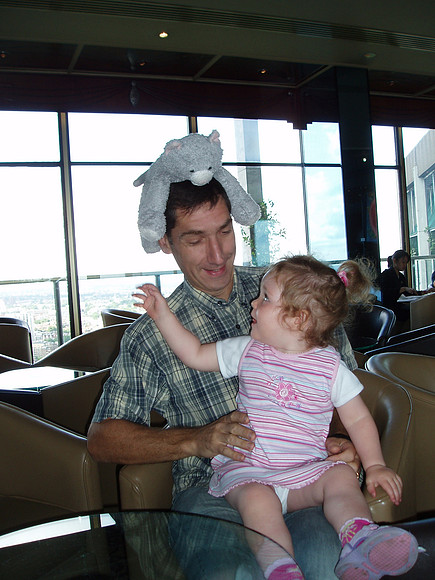 What do you call a man with a cat on his head
