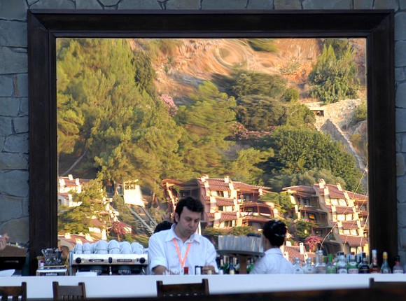 hillside reflected in bar mirror