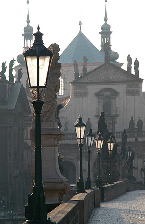 charles bridge streetlights at dawn