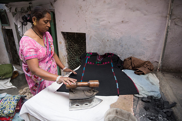 Street ironing, old city side-alley, Delhi