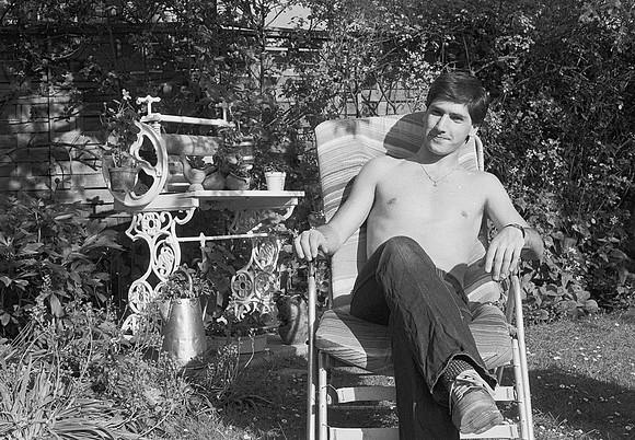 Gary bare chest in garden chair