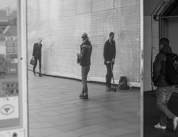 Big Issue vendor in mirror