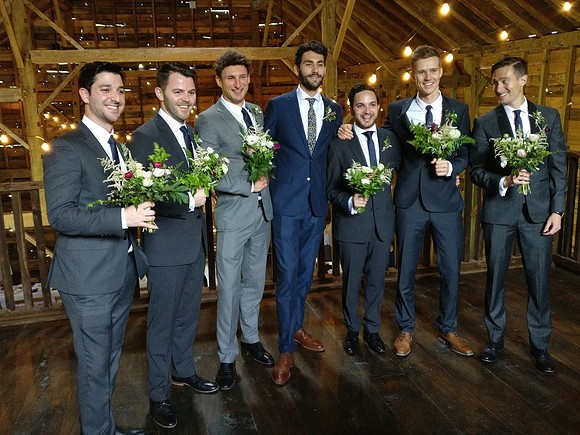 Groomsmen with bouquets
