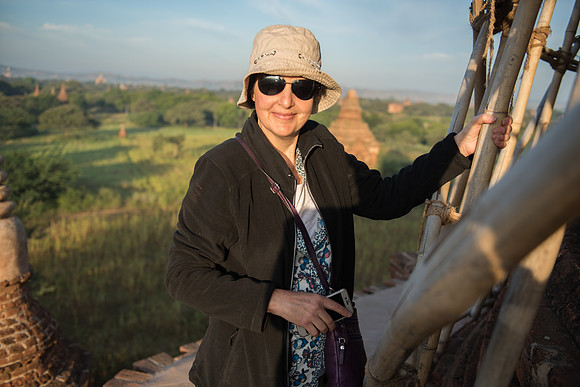 Bagan stupa Jenni clings to scaffold