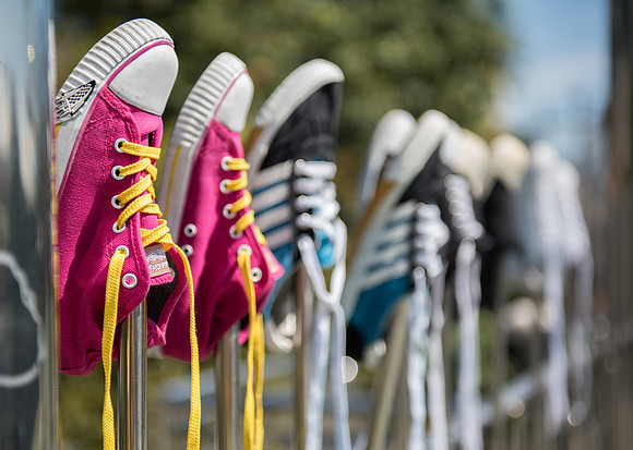 Bangkok trainers on railing