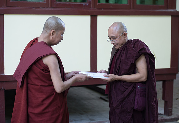 Mandalay monks passing book