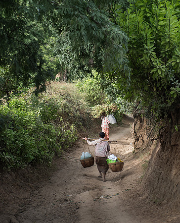 Villagers carrying goods