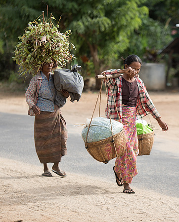 Villagers carrying goods