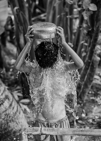 Burmese boy bathing bw