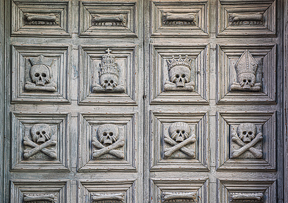 Matera church door skulls
