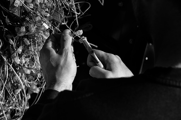 Brick Lane BT engineer hands bw