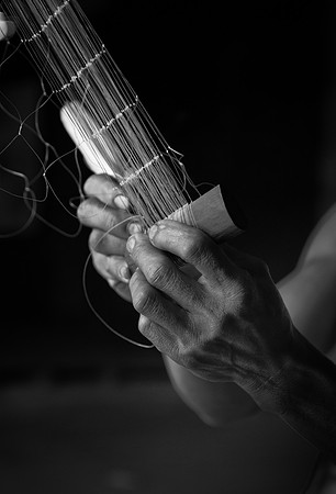 Mengkak fishnet repair hands bw