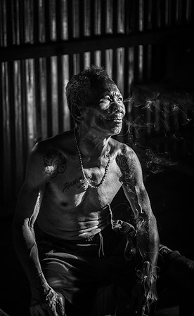Mengkak Iban man smoking  bw