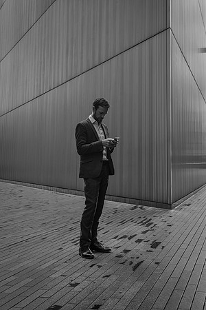 More London man on phone bw