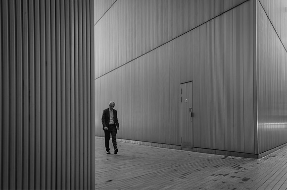 More London man striding bw